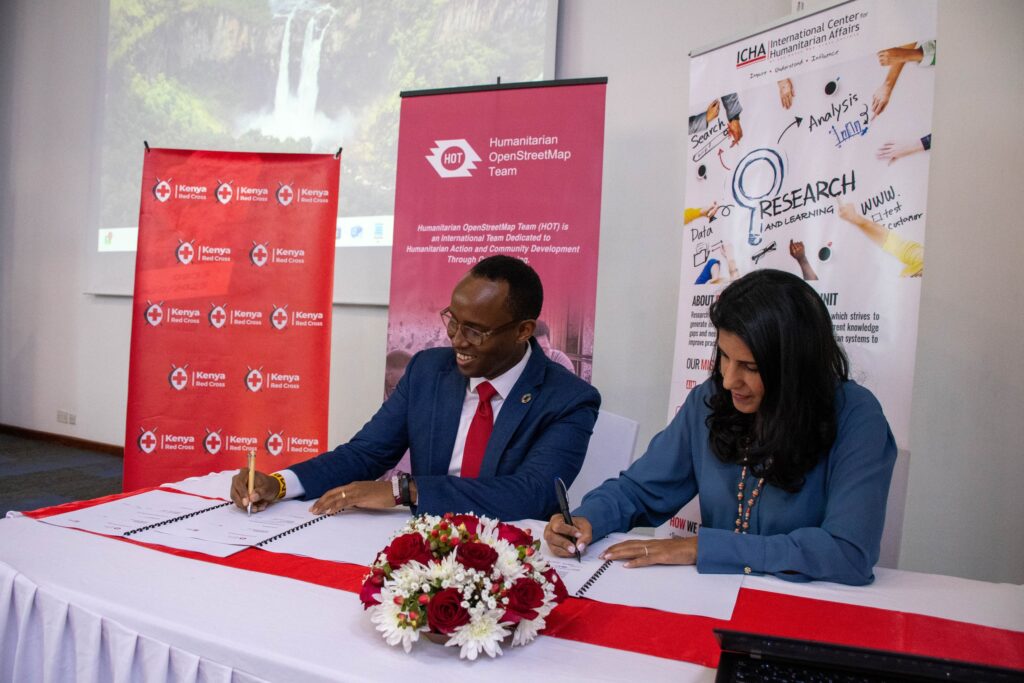 Representatives formalising an institutional partnership.